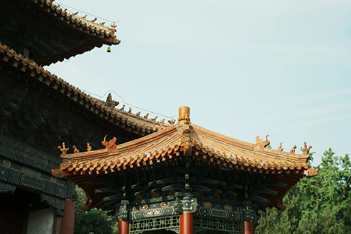 Golden Taoist temple roof detail under open sky