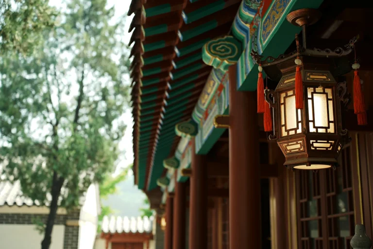 Traditional lantern under Taoist temple eave