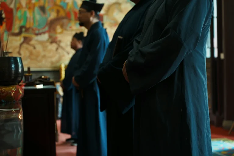 Close view of Taoist practitioners during temple ritual service