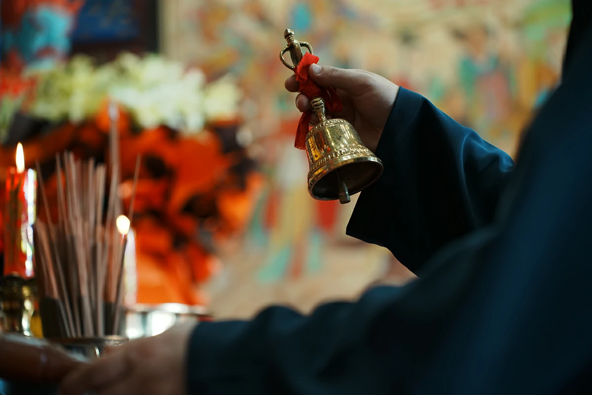 Taoist ritual bell held during temple ceremony