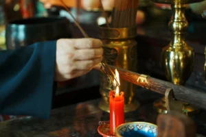 Taoist candle flame and altar offering for blessing service