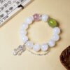 clear quartz amethyst bracelet,clear thinking crystal bracelet,minimalist crystal bracelet,white crystal purple crystal bracelet,amethyst bracelet for daily wear,clear quartz bracelet,shell pearl crystal bracelet,symbolic cleansing bracelet,focus symbolism bracelet,TS-209 bracelet